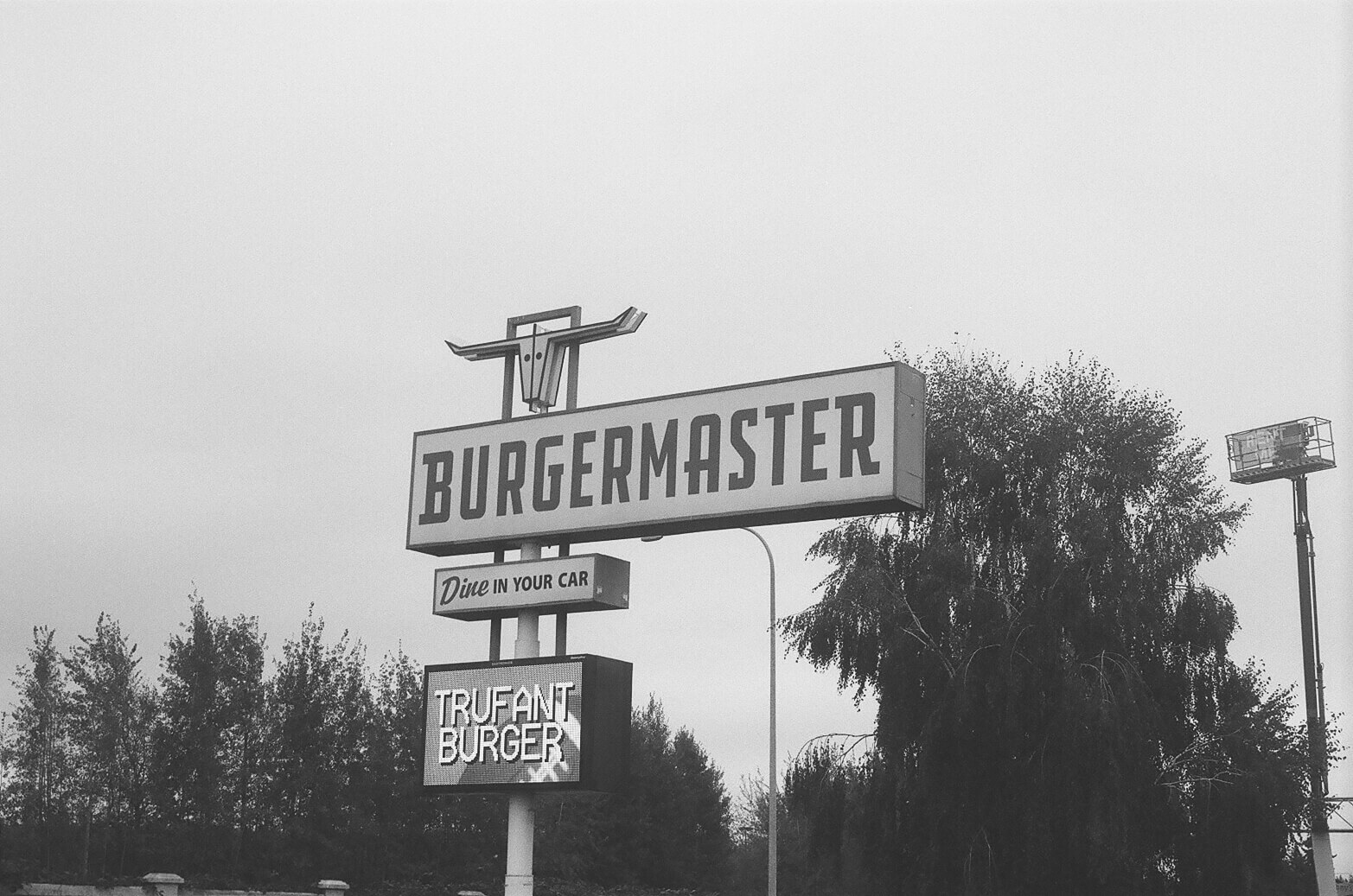 Film photo of the burger master logo.